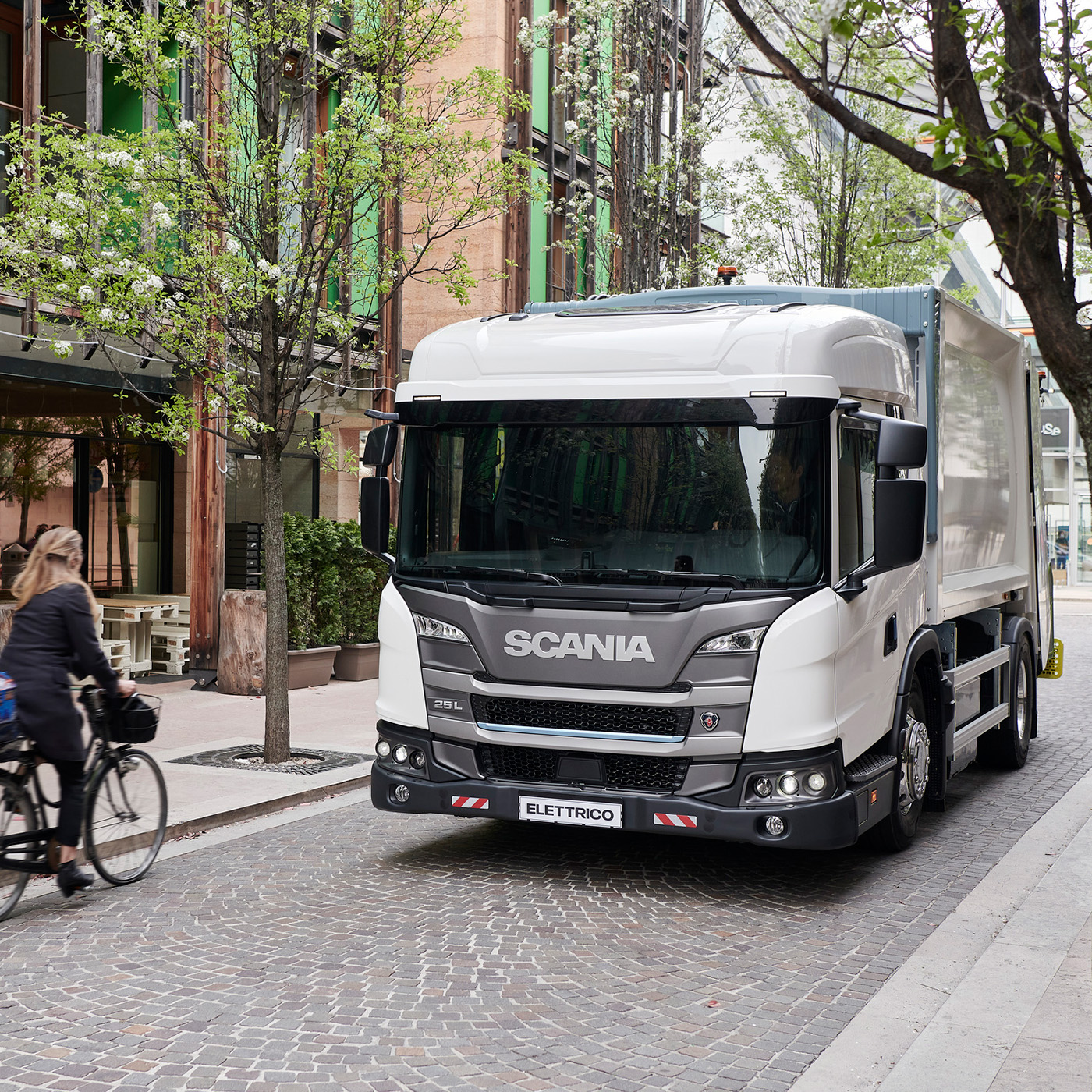 Scania L-series low-entry cab truck driving on small street 