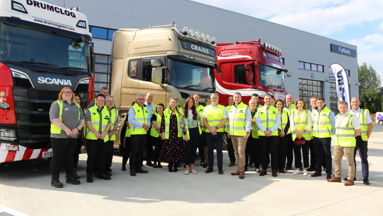 Scania colleauges standing outside branch