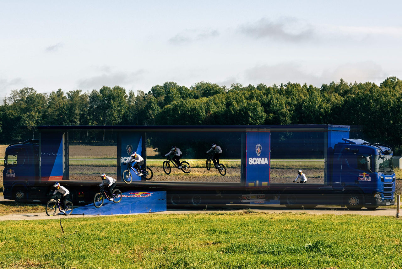 Matt Jones jumping through two trailers on bike