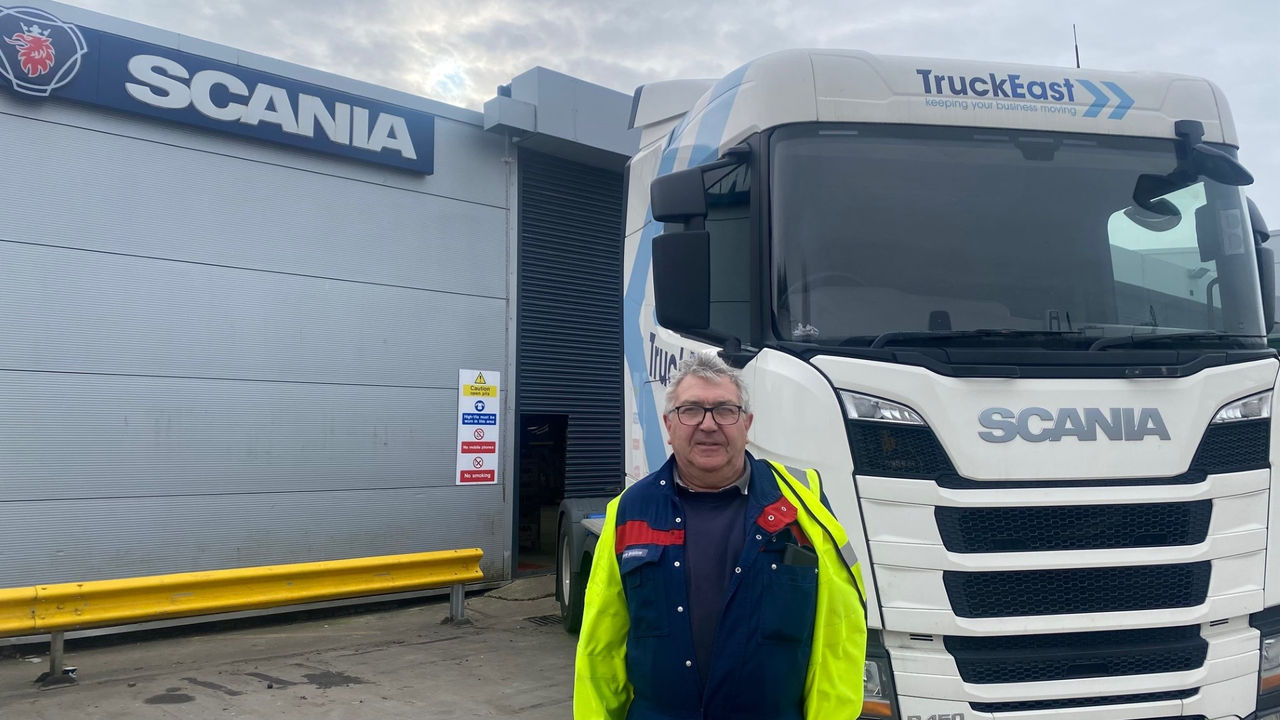HGV Technician standing in front of Workshop